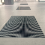 gratings-in-the-granite-floor-for-water-drainage